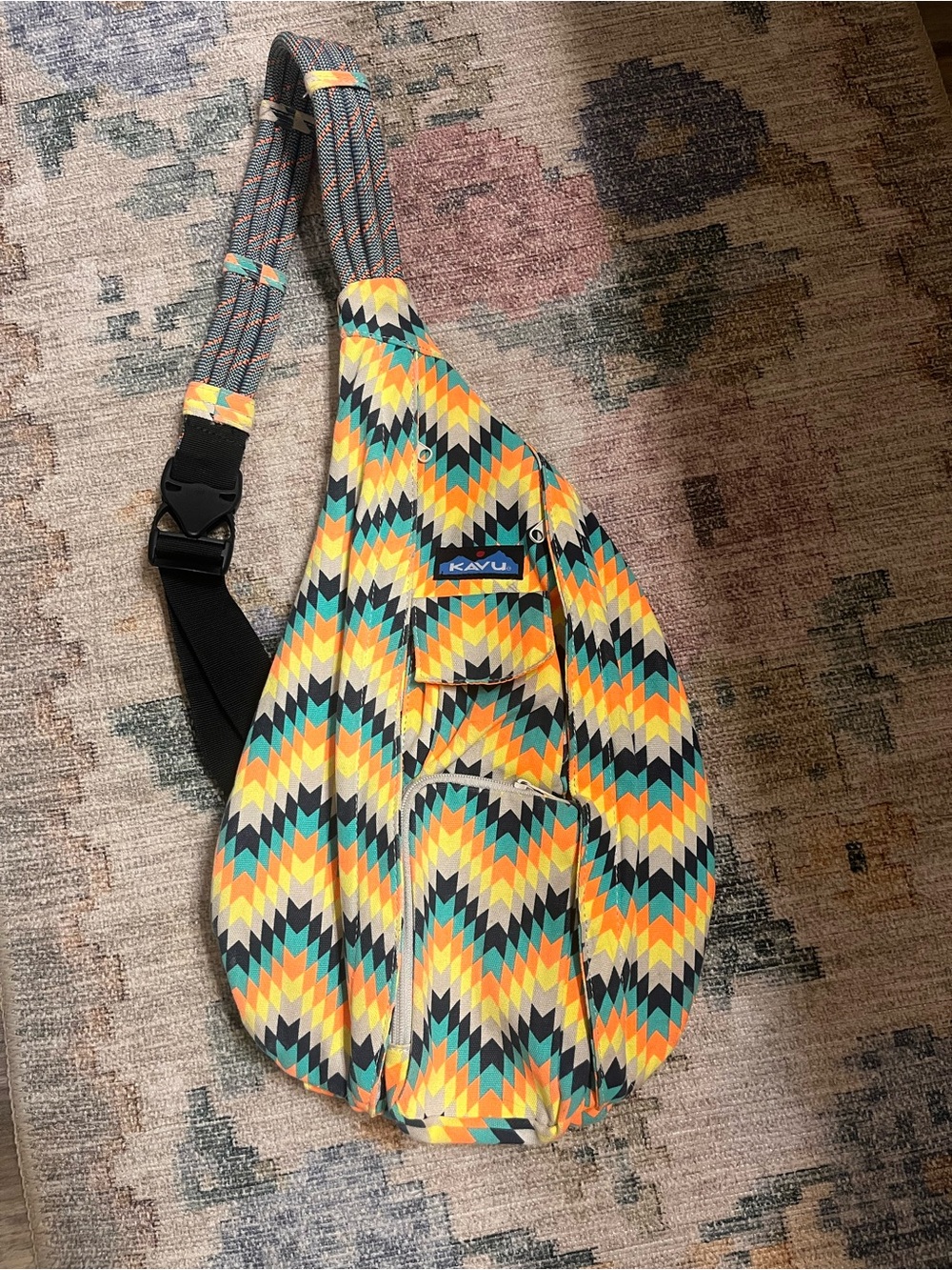 Kavu Rope Sling Bag in Orange, Yellow, Tan & Teal